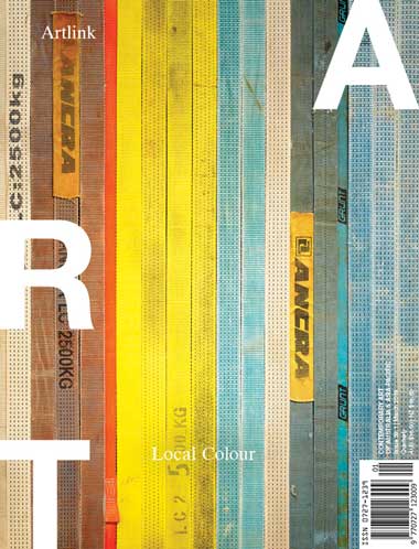 Magazine cover showing strips of wood in different colours from brown to yellow to blue.